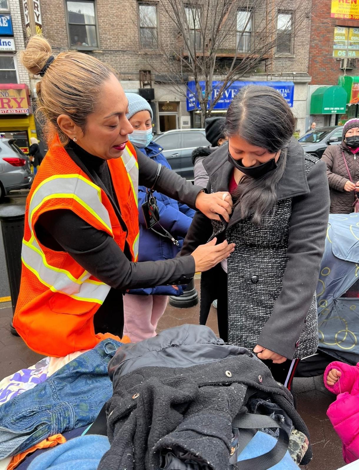 Coat fitting volunteer